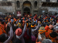 Hindu sadhus (holy men) from the Juna Akhara take part in a religious procession towards the Sangam area during the first entry for the Maha...