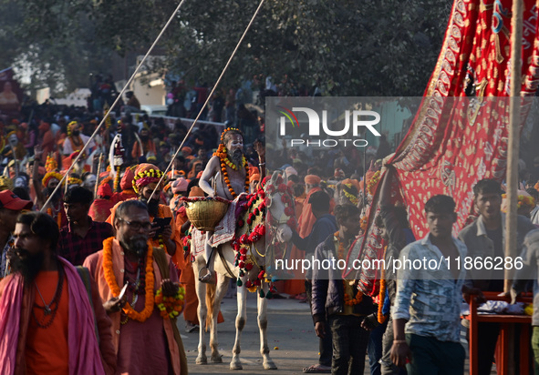 Hindu sadhus (holy men) from the Juna Akhara take part in a religious procession towards the Sangam area during the first entry for the Maha...