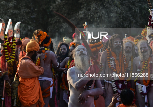 Hindu sadhus (holy men) from the Juna Akhara take part in a religious procession towards the Sangam area during the first entry for the Maha...