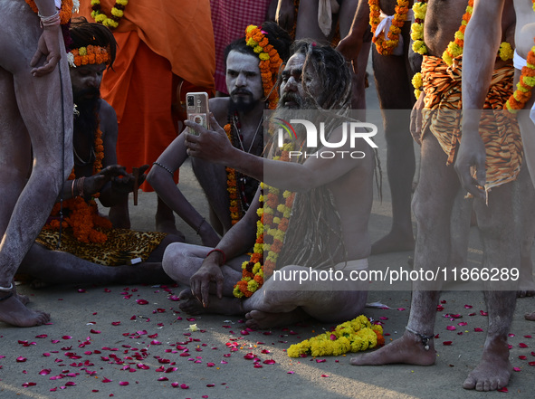 Hindu sadhus (holy men) from the Juna Akhara take part in a religious procession towards the Sangam area during the first entry for the Maha...