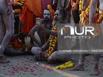 Hindu sadhus (holy men) from the Juna Akhara take part in a religious procession towards the Sangam area during the first entry for the Maha...