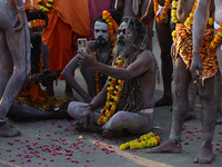 Hindu sadhus (holy men) from the Juna Akhara take part in a religious procession towards the Sangam area during the first entry for the Maha...