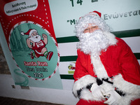 People wearing Santa Claus costumes participate in the annual Santa Run in Athens, Greece, on December 14, 2024. (