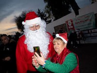 People wearing Santa Claus costumes participate in the annual Santa Run in Athens, Greece, on December 14, 2024. (