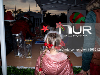 People wearing Santa Claus costumes participate in the annual Santa Run in Athens, Greece, on December 14, 2024. (