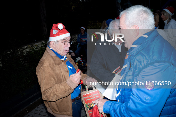 People wearing Santa Claus costumes participate in the annual Santa Run in Athens, Greece, on December 14, 2024. 