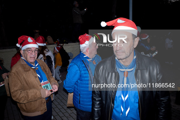 People wearing Santa Claus costumes participate in the annual Santa Run in Athens, Greece, on December 14, 2024. 