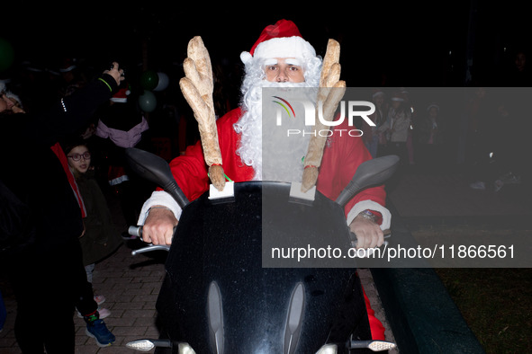 People wearing Santa Claus costumes participate in the annual Santa Run in Athens, Greece, on December 14, 2024. 