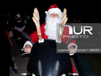 People wearing Santa Claus costumes participate in the annual Santa Run in Athens, Greece, on December 14, 2024. (