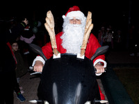 People wearing Santa Claus costumes participate in the annual Santa Run in Athens, Greece, on December 14, 2024. (