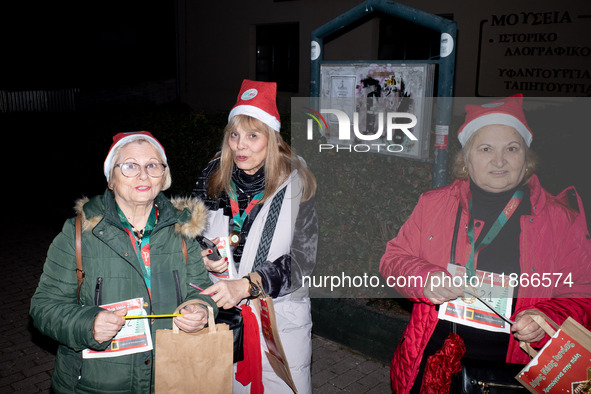 People wearing Santa Claus costumes participate in the annual Santa Run in Athens, Greece, on December 14, 2024. 