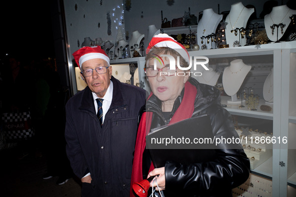 People wearing Santa Claus costumes participate in the annual Santa Run in Athens, Greece, on December 14, 2024. 