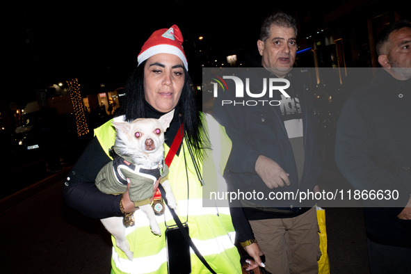 People wearing Santa Claus costumes participate in the annual Santa Run in Athens, Greece, on December 14, 2024. 