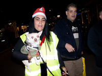 People wearing Santa Claus costumes participate in the annual Santa Run in Athens, Greece, on December 14, 2024. (