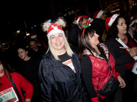 People wearing Santa Claus costumes participate in the annual Santa Run in Athens, Greece, on December 14, 2024. (