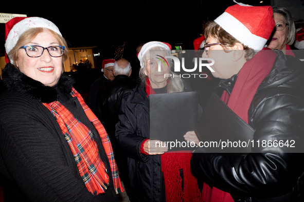 People wearing Santa Claus costumes participate in the annual Santa Run in Athens, Greece, on December 14, 2024. 