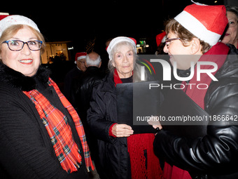 People wearing Santa Claus costumes participate in the annual Santa Run in Athens, Greece, on December 14, 2024. (