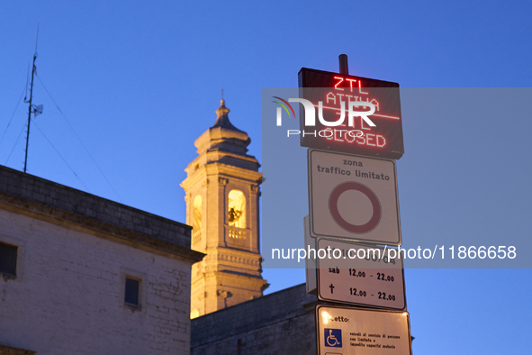 The photo shows the display marking the beginning of the Limited Traffic Zone (ZTL) in the historic center of Locorotondo, Bari. The sign in...