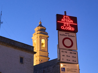 The photo shows the display marking the beginning of the Limited Traffic Zone (ZTL) in the historic center of Locorotondo, Bari. The sign in...