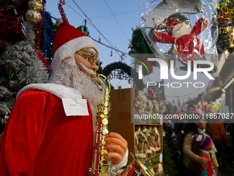 A Santa Claus decorative article is displayed at a stall at a market in New Delhi, India, on December 14, 2024. (