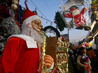 A Santa Claus decorative article is displayed at a stall at a market in New Delhi, India, on December 14, 2024. (