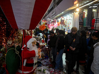 A Santa Claus decorative article is displayed at a stall at a market in New Delhi, India, on December 14, 2024. (