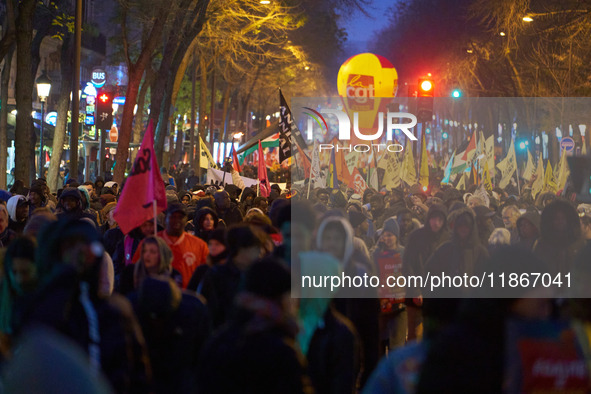 A demonstration against repressive migration policies gathers several hundred people in Paris, France, on December 14. Protesters march thro...