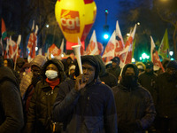 A demonstration against repressive migration policies gathers several hundred people in Paris, France, on December 14. Protesters march thro...