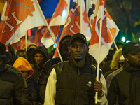 A demonstration against repressive migration policies gathers several hundred people in Paris, France, on December 14. Protesters march thro...