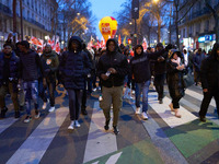 A demonstration against repressive migration policies gathers several hundred people in Paris, France, on December 14. Protesters march thro...