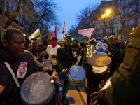 A demonstration against repressive migration policies gathers several hundred people in Paris, France, on December 14. Protesters march thro...