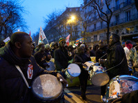 A demonstration against repressive migration policies gathers several hundred people in Paris, France, on December 14. Protesters march thro...