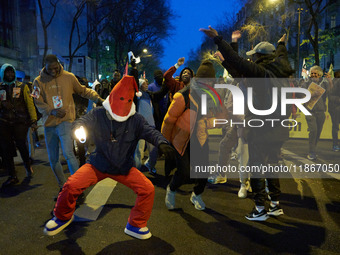 A demonstration against repressive migration policies gathers several hundred people in Paris, France, on December 14. Protesters march thro...