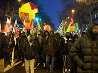 A demonstration against repressive migration policies gathers several hundred people in Paris, France, on December 14. Protesters march thro...