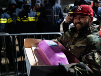 Anti-government demonstrators gather outside the Georgian parliament after the parliament members elect a new president in Tbilisi, Georgia,...