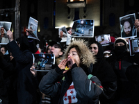 Anti-government demonstrators gather outside the Georgian parliament after the parliament members elect a new president in Tbilisi, Georgia,...