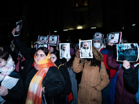 Anti-government demonstrators gather outside the Georgian parliament after the parliament members elect a new president in Tbilisi, Georgia,...