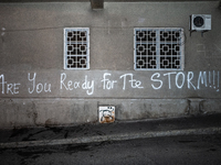 A tag on the Parliament's wall reads ''are you ready for the storm'' as anti-government demonstrators gather outside the Georgian parliament...