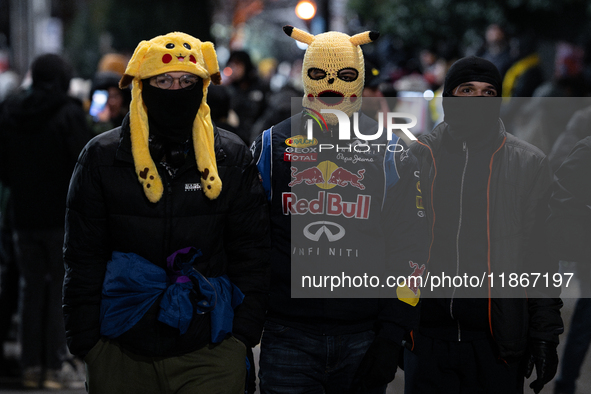 Anti-government demonstrators gather outside the Georgian parliament after the parliament members elect a new president in Tbilisi, Georgia,...