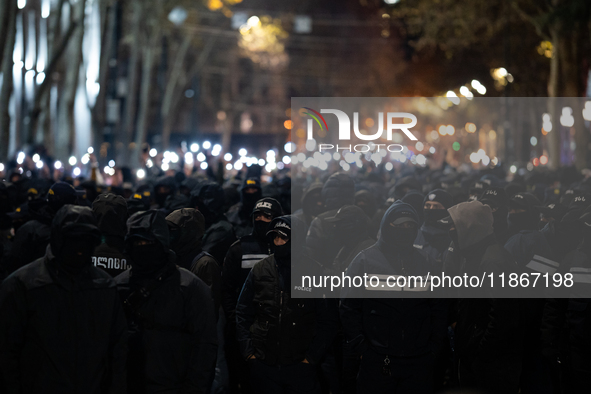 Police officers block the Georgian Parliament building as anti-government demonstrators gather outside the parliament in Tbilisi, Georgia, o...