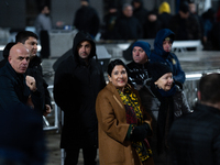 Georgia's outgoing President Salome Zourabichvili walks outside the Georgian parliament during an anti-government rally after the parliament...