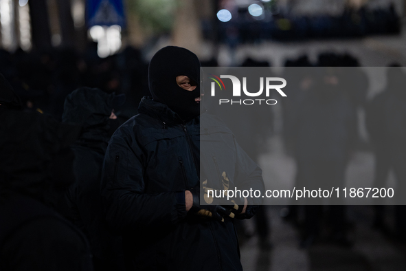 Police officers block the Georgian Parliament building as anti-government demonstrators gather outside the parliament in Tbilisi, Georgia, o...