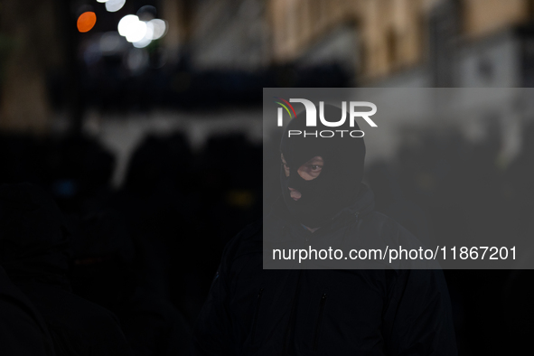 Police officers block the Georgian Parliament building as anti-government demonstrators gather outside the parliament in Tbilisi, Georgia, o...