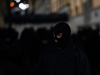 Police officers block the Georgian Parliament building as anti-government demonstrators gather outside the parliament in Tbilisi, Georgia, o...