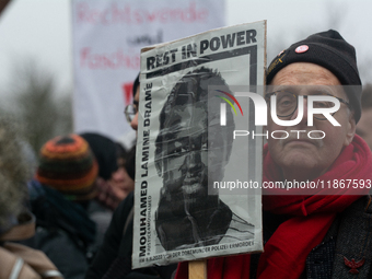 More than a thousand people take part in a demonstration against the latest court verdict over the police shooting that results in the death...