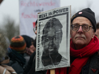 More than a thousand people take part in a demonstration against the latest court verdict over the police shooting that results in the death...