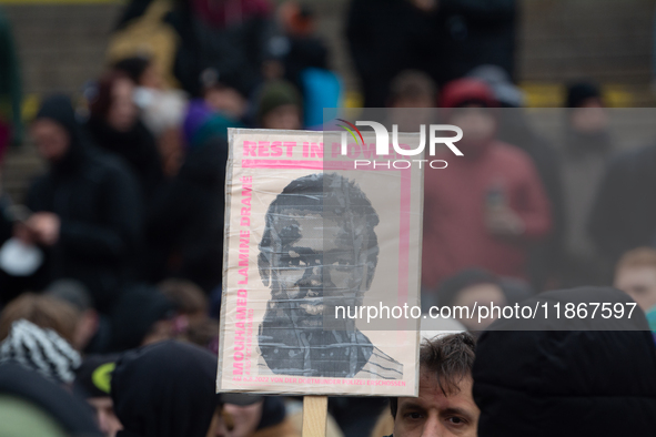 More than a thousand people take part in a demonstration against the latest court verdict over the police shooting that results in the death...