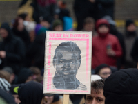 More than a thousand people take part in a demonstration against the latest court verdict over the police shooting that results in the death...