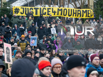 More than a thousand people take part in a demonstration against the latest court verdict over the police shooting that results in the death...