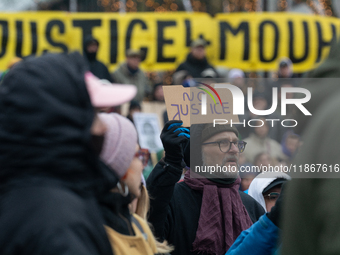 More than a thousand people take part in a demonstration against the latest court verdict over the police shooting that results in the death...